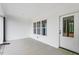 Covered back patio with white vinyl siding and a view to the property's backyard at 250 Ellington Rd, Graham, NC 27253