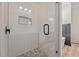 Modern shower features glass door, circular inset shelving and pebble tile flooring at 250 Ellington Rd, Graham, NC 27253