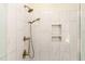 A luxurious shower with dual showerheads, white marble tile, and built-in soap niches at 250 Ellington Rd, Graham, NC 27253