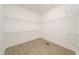 An organized walk-in closet with metal shelving for efficient storage solutions at 250 Ellington Rd, Graham, NC 27253