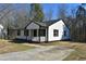 White house with black shutters and a porch at 2500 Sundial Cir, Durham, NC 27704