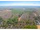 Expansive aerial view of a wooded lot ready for building with a beautiful, natural landscape at 2801 Mount View Church Rd, Moncure, NC 27559