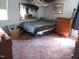 Cozy bedroom featuring a bed and traditional wood furniture at 306 Eastway Ln, Graham, NC 27253