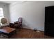 Bright living room featuring stylish furniture and laminate floors at 306 Eastway Ln, Graham, NC 27253