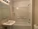 Bathroom with pedestal sink, tub, and shower at 3077 Christian Light Road Rd, Fuquay Varina, NC 27526