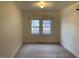 Spacious bedroom with two windows and neutral decor at 3077 Christian Light Road Rd, Fuquay Varina, NC 27526