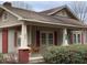 Tan house with red brick porch and shutters at 3077 Christian Light Road Rd, Fuquay Varina, NC 27526