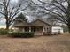Ranch house with covered porch, detached building, and mature trees at 3077 Christian Light Road Rd, Fuquay Varina, NC 27526