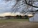 Open farmland view with barn and tree line at 3077 Christian Light Road Rd, Fuquay Varina, NC 27526