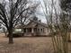 Tan house with red brick foundation and porch at 3077 Christian Light Road Rd, Fuquay Varina, NC 27526