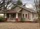 Tan house with red brick foundation and porch at 3077 Christian Light Road Rd, Fuquay Varina, NC 27526