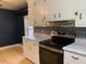 Updated kitchen with white cabinets and stainless steel appliances at 3077 Christian Light Road Rd, Fuquay Varina, NC 27526