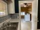 Kitchen with stainless steel sink and view into laundry room at 3077 Christian Light Road Rd, Fuquay Varina, NC 27526