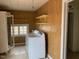 Laundry room with washer, dryer, and built-in shelving at 3077 Christian Light Road Rd, Fuquay Varina, NC 27526