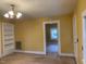 Living room with built-in shelving and view to another room at 3077 Christian Light Road Rd, Fuquay Varina, NC 27526