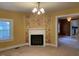 Living room with fireplace and floral wallcovering at 3077 Christian Light Road Rd, Fuquay Varina, NC 27526