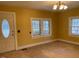 Living room with window, door and neutral walls at 3077 Christian Light Road Rd, Fuquay Varina, NC 27526