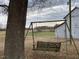 Rustic swing set near barn in open field at 3077 Christian Light Road Rd, Fuquay Varina, NC 27526