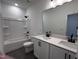 Bright bathroom featuring double sink vanity, tub with shower, and tiled floor at 3271 Roundly Rd # 9, New Hill, NC 27562