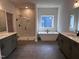 Bathroom featuring modern tub, sleek shower, and double sink vanity at 3271 Roundly Rd # 9, New Hill, NC 27562