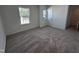 Comfortable bedroom with soft carpeting, a window for natural light, and a closet at 3271 Roundly Rd # 9, New Hill, NC 27562