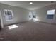 Bright bedroom with three windows offering ample natural light and neutral carpeting at 3271 Roundly Rd # 9, New Hill, NC 27562