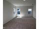 Bedroom featuring three windows and neutral carpeting, bathed in natural light at 3271 Roundly Rd # 9, New Hill, NC 27562
