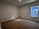 Bedroom with neutral carpet, natural light, and simple design at 3271 Roundly Rd # 9, New Hill, NC 27562