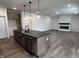 Open concept kitchen featuring a center island, modern lighting, and a connected living area at 3271 Roundly Rd # 9, New Hill, NC 27562