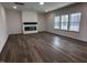 Bright and airy living room with modern fireplace and natural light at 3271 Roundly Rd # 9, New Hill, NC 27562