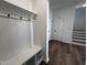 View of a bright mudroom with white wainscoting and built-in bench at 3271 Roundly Rd # 9, New Hill, NC 27562