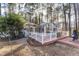 Deck with wooded views and sunroom access at 3872 Hope Valley Rd, Durham, NC 27707