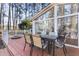 Deck with table and chairs, overlooking the woods at 3872 Hope Valley Rd, Durham, NC 27707