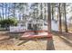 Home's back deck overlooks a wooded backyard at 3872 Hope Valley Rd, Durham, NC 27707