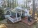 Deck and sunroom overlooking a wooded area at 3872 Hope Valley Rd, Durham, NC 27707