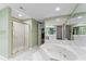 Elegant bathroom with a large bathtub, shower, and double vanity at 3872 Hope Valley Rd, Durham, NC 27707