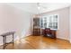 Charming bedroom with hardwood floors, built-in desk and chair at 3872 Hope Valley Rd, Durham, NC 27707