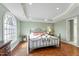 Spacious bedroom with a metal frame bed and large window overlooking backyard at 3872 Hope Valley Rd, Durham, NC 27707