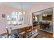 Bright breakfast room with table and views into other rooms at 3872 Hope Valley Rd, Durham, NC 27707