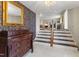 Elegant entryway with staircase and view to living room at 3872 Hope Valley Rd, Durham, NC 27707
