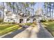 White house with a long driveway and mature trees at 3872 Hope Valley Rd, Durham, NC 27707