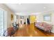 Living room with hardwood floors and staircase at 3872 Hope Valley Rd, Durham, NC 27707