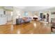 Living room with hardwood floors and view of kitchen at 3872 Hope Valley Rd, Durham, NC 27707
