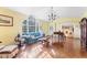 Bright living room features hardwood floors, large windows, and ample seating at 3872 Hope Valley Rd, Durham, NC 27707