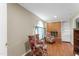 Cozy sitting room featuring a brick fireplace and comfortable armchairs at 3872 Hope Valley Rd, Durham, NC 27707