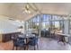 Sunroom with tiled floor, sliding glass doors, and deck access at 3872 Hope Valley Rd, Durham, NC 27707