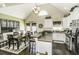 Eat-in kitchen with island, stainless steel appliances, and hardwood floors at 3977 Baybrook Rd, Nashville, NC 27856