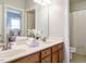Bathroom with double vanity and a view of a bedroom at 401 Streamwood Dr, Holly Springs, NC 27540