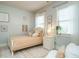 Bedroom with a queen bed, light walls, and a neutral color scheme at 401 Streamwood Dr, Holly Springs, NC 27540