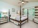 Bright bedroom with a large four-poster bed and ample natural light at 401 Streamwood Dr, Holly Springs, NC 27540